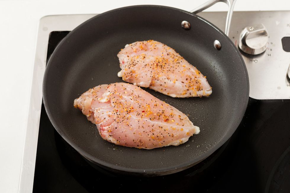 Heat up grill pan. When the pan is hot, add chicken and cook for about 3 minutes on both sides. Then, set chicken aside.