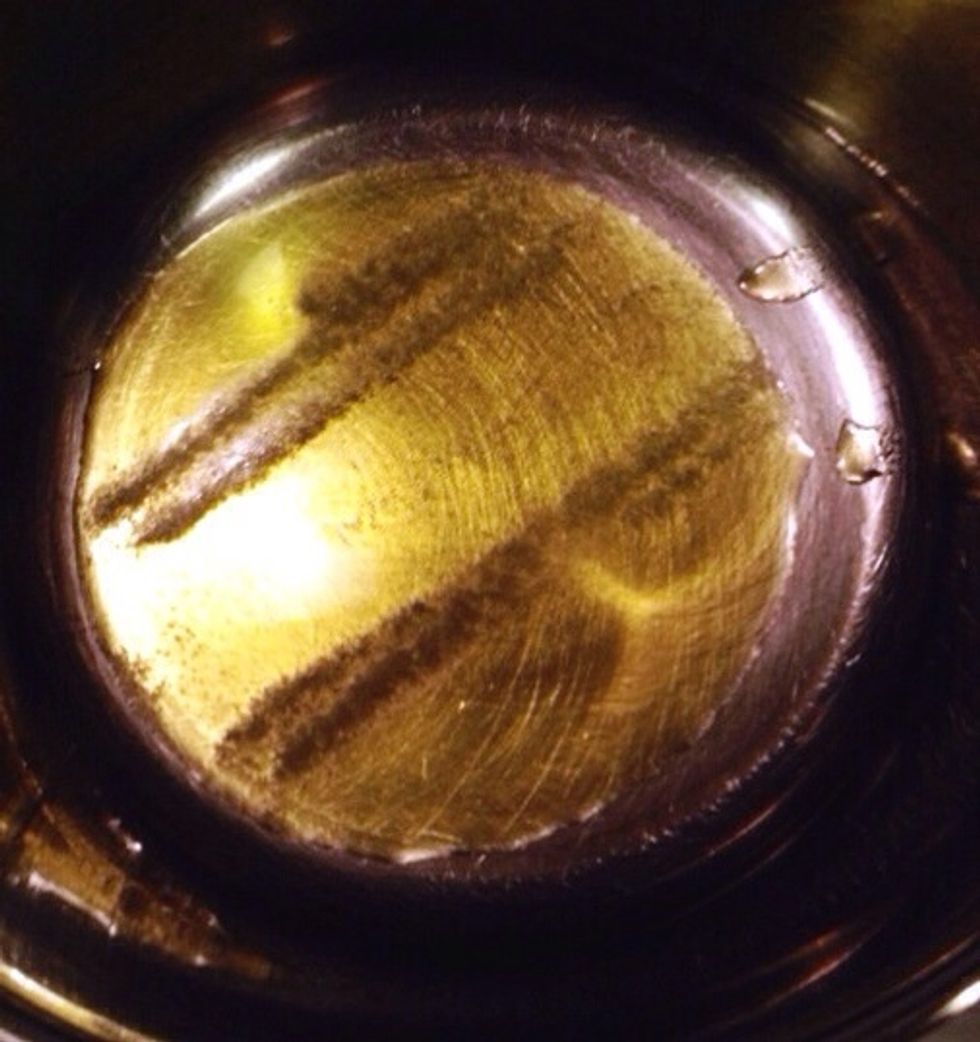 Heat up olive oil and salt in a pan.