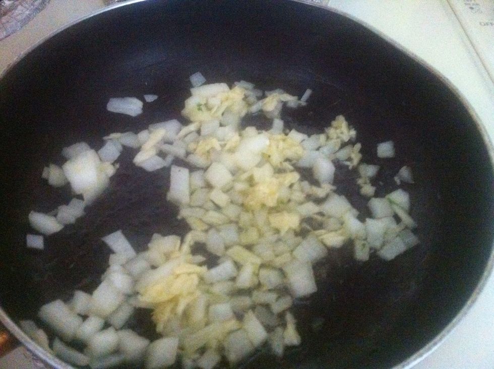 Heat up one tablespoon of olive oil and add onion and garlic, saut\u00e9 till golden.