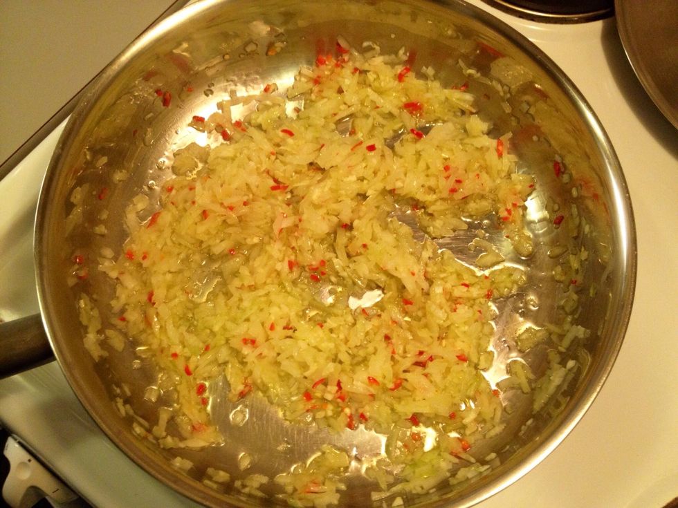 Heat up onions, garlic and chili. Let the onions become "shiny".