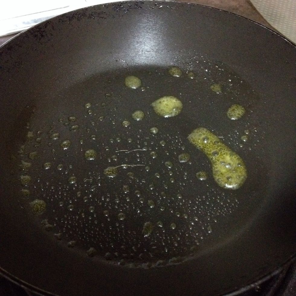 Heat up the frying pan and add half a cube of butter.