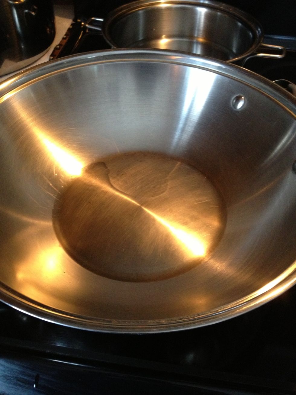 Heat up the oil in a wok or any pan.
