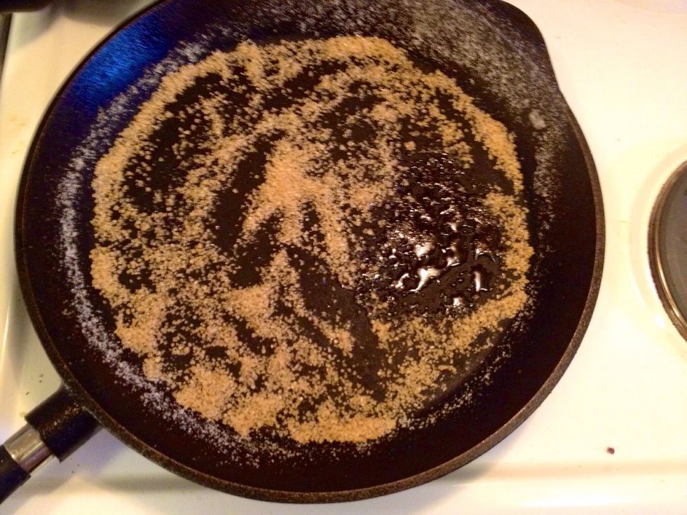 Heat up the sugar in a skillet. Here you have to be very careful that the sugar doesn't burn. The steps following here go very fast so you cannot really do something else at the same time...