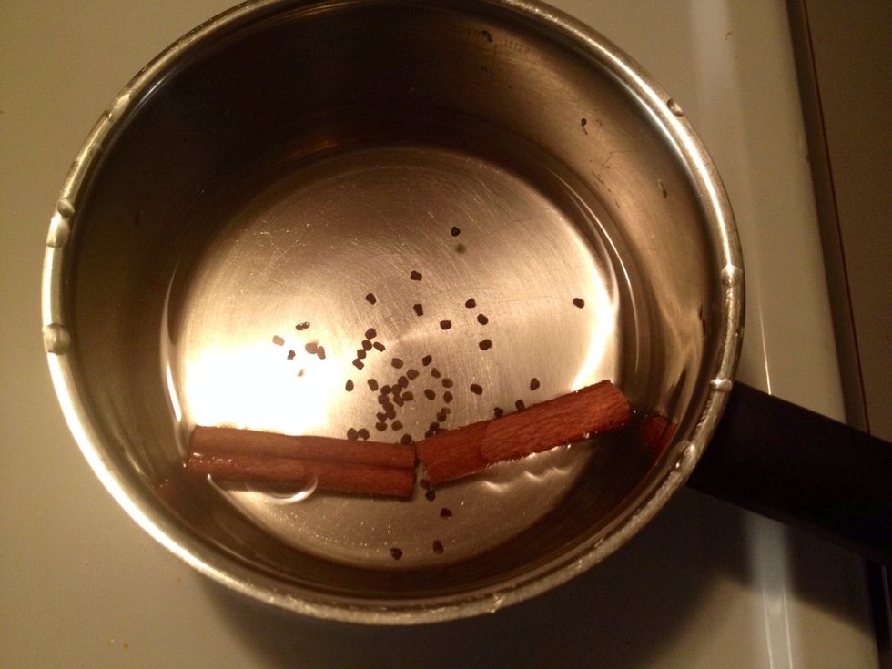 Heat up the water and the spices (cardamon & cinnamon). Simmer for 5 minutes. This will become like a syrup.