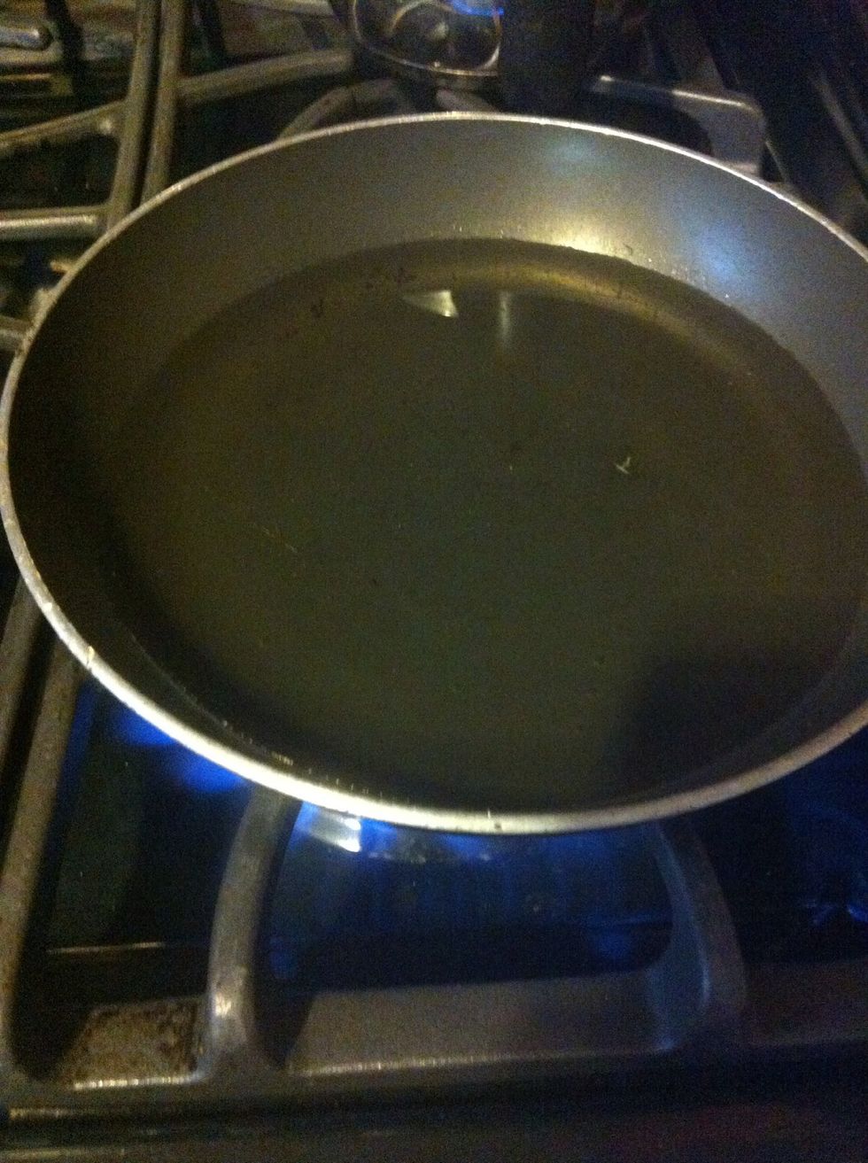 Heat up your oil! Don't let it get too hot. We're looking for about 350\u00b0F