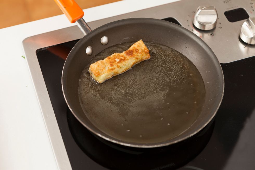 Heat vegetable oil in a large skillet and fry avocado egg rolls until brown and crispy, about 2-3 minutes.