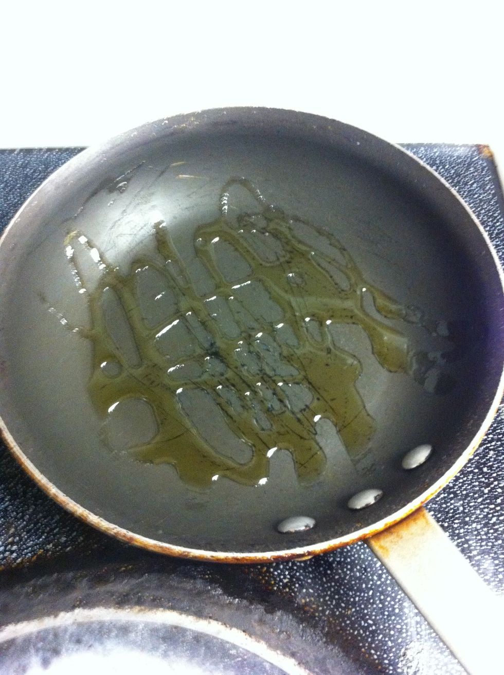 Heat Vegetable Oil in pan over Medium heat.