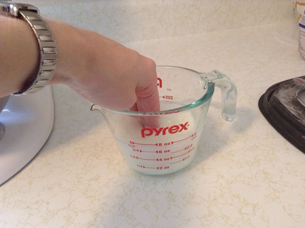 Heat water and milk in microwave until quite warm, about 1 minute. You should be able to comfortably keep your fingers in the liquid after heating.