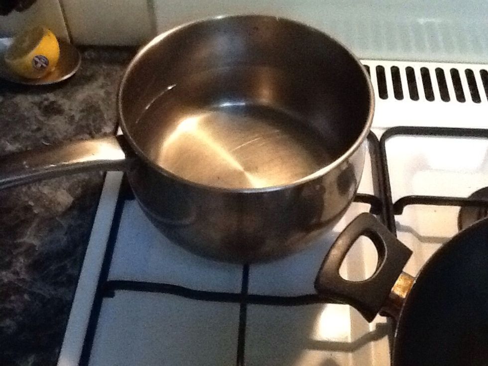 Heat water until it boils.