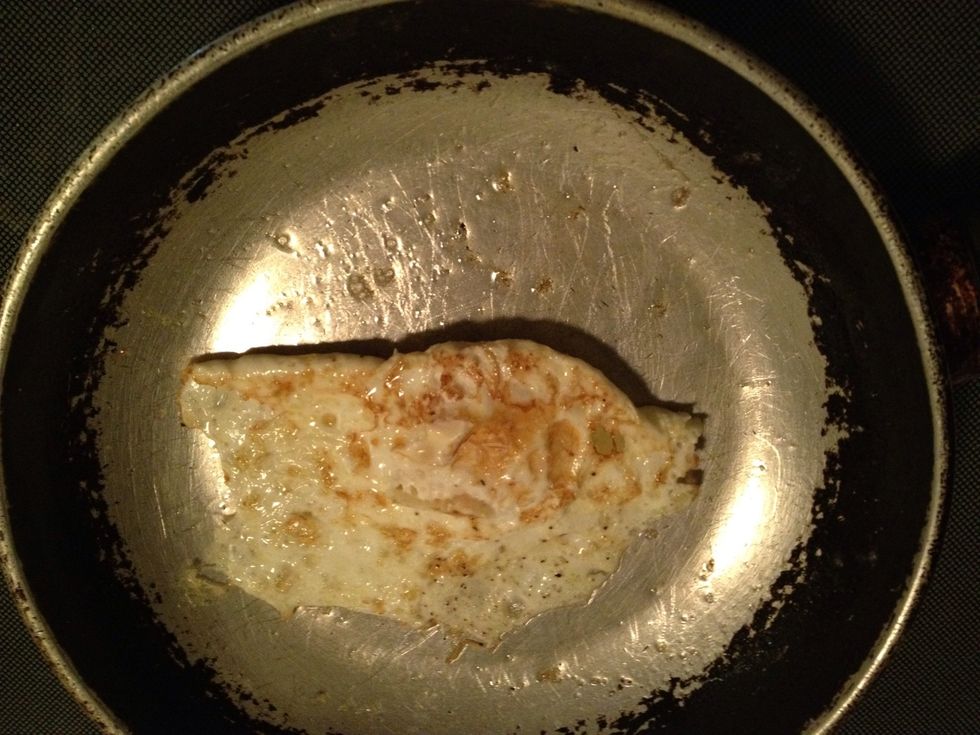 Heat your 2nd skillet to medium low. Coat with butter (or substitute) so egg wont burn or stick to pan. Crack open egg in pan. Salt&Pepper it to taste. After cooked on one side, flip it over n repeat.