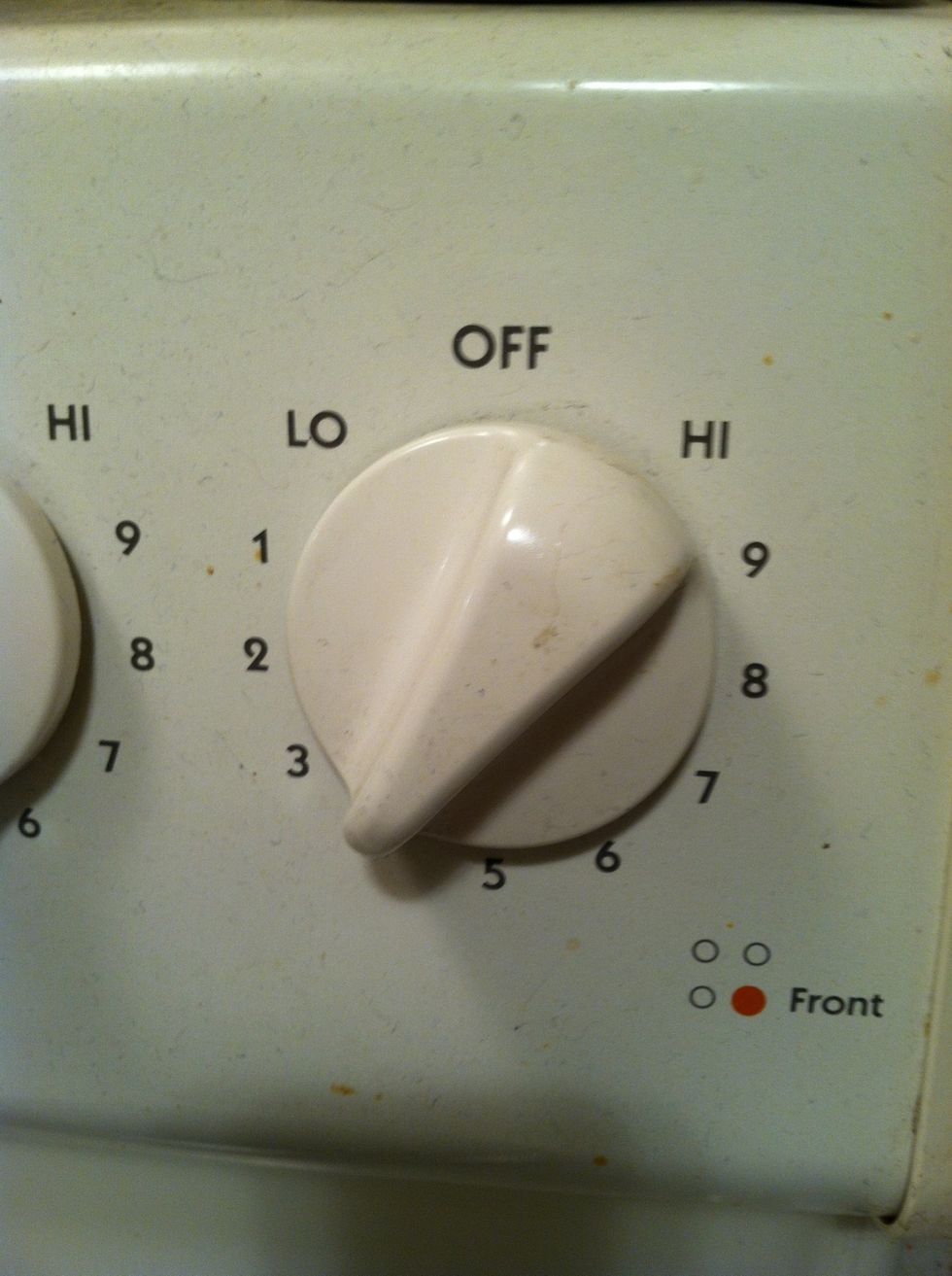 Heat your burner to 4, or medium low. If you have a splatter screen, place it over the pan now to help minimize grease splatters in your kitchen.
