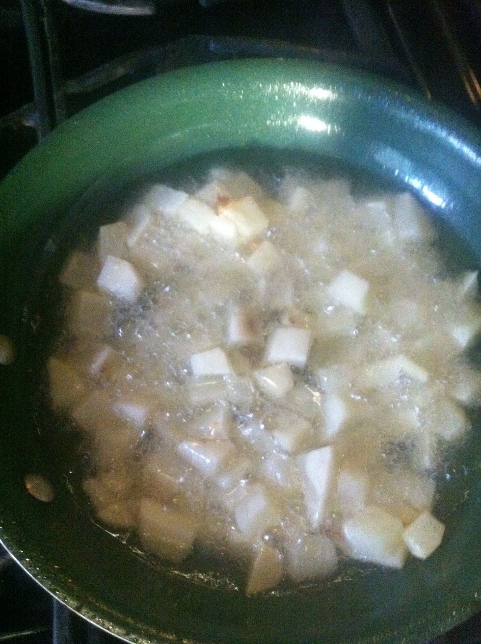 Heat your canola oil in your pan, start frying your potato cubes until golden brown.