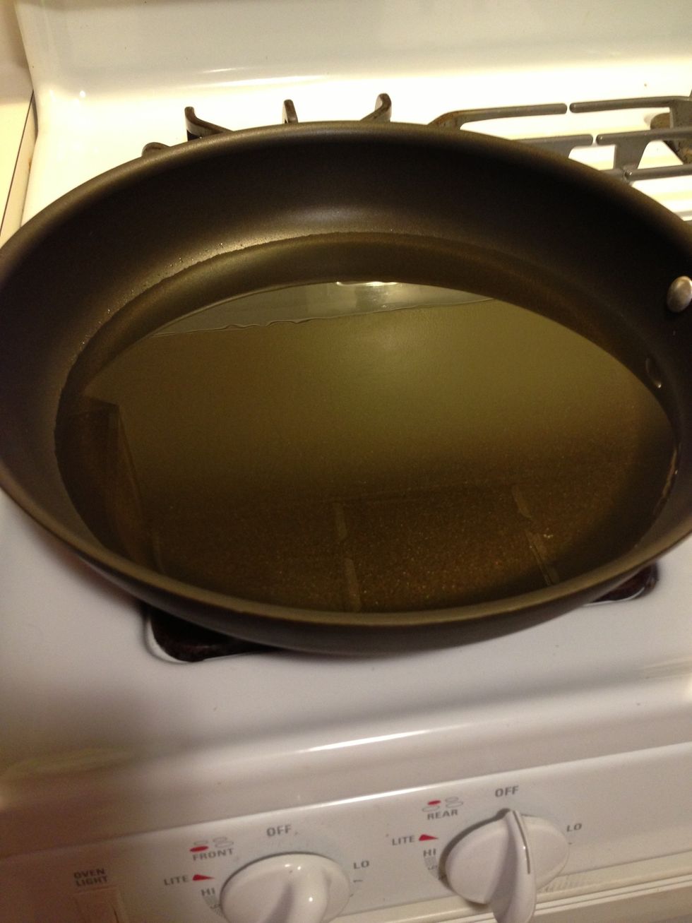 Heat your oil (about 2" deep in a large pan) to around 200 F. If you need to test and don't have a thermometer, drop some of your dry mixture in. It should sizzle if the oil is hot enough.