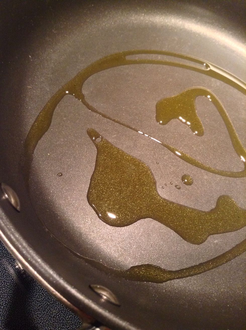 Heat your olive oil in a large skillet over medium heat.