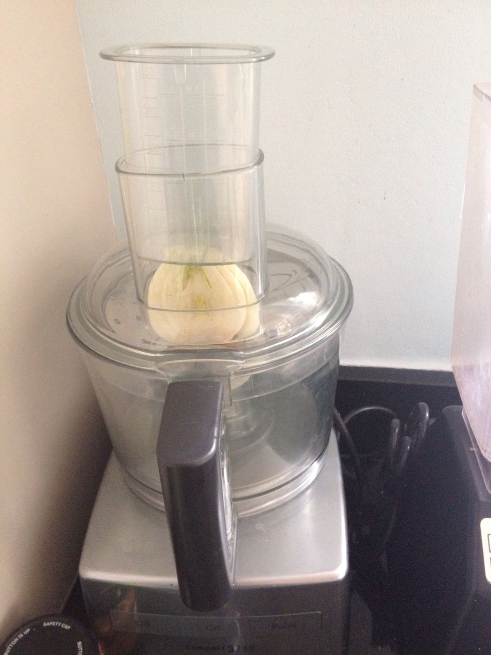 Heat your oven to around 200c (400f) or gas mark 6. Use a food processor slicing attachment to thinly slice fennel and spring onions - or ask a friend to help with this bit.