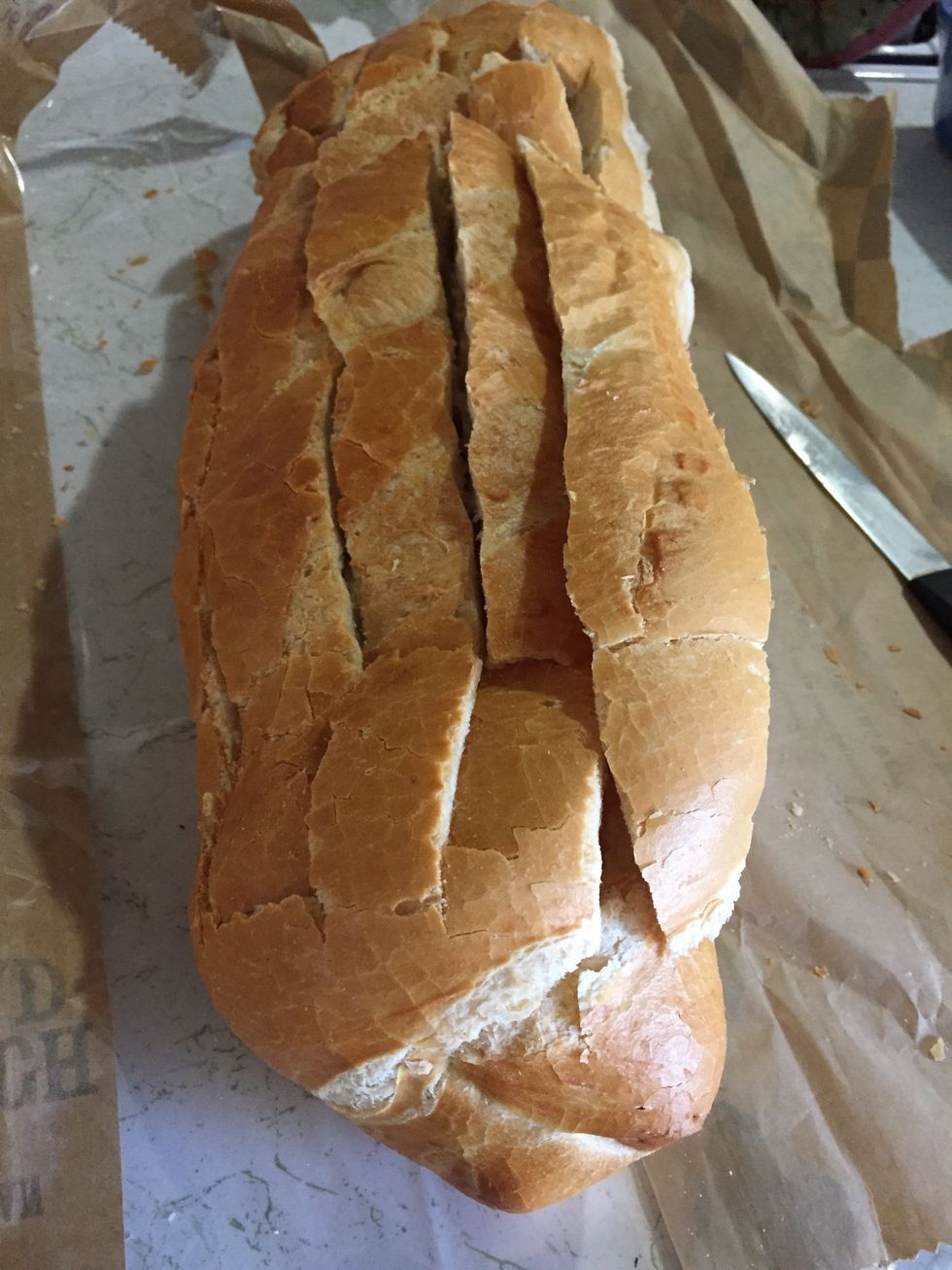 Heated your oven at 350F. Cut your bread in straight line.