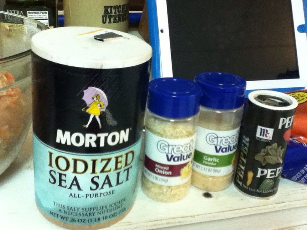 Heavily sprinkle the mixture with salt, garlic powder, onion powder, and pepper.