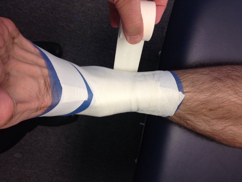 Heel lock: Wrap around the leg to finish or continue for another heel lock. Complete a min of 2 heel locks on each side of the heel.