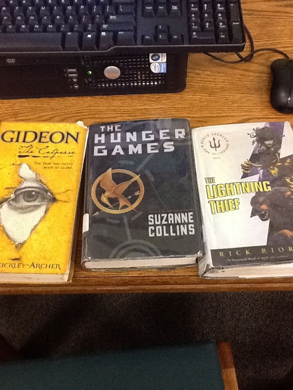 Hello, I'm Sam, I will be showing you how to shelve a fiction book. Today, I will be using the books: The Lightning Thief, Gideon, and The Hunger Games.