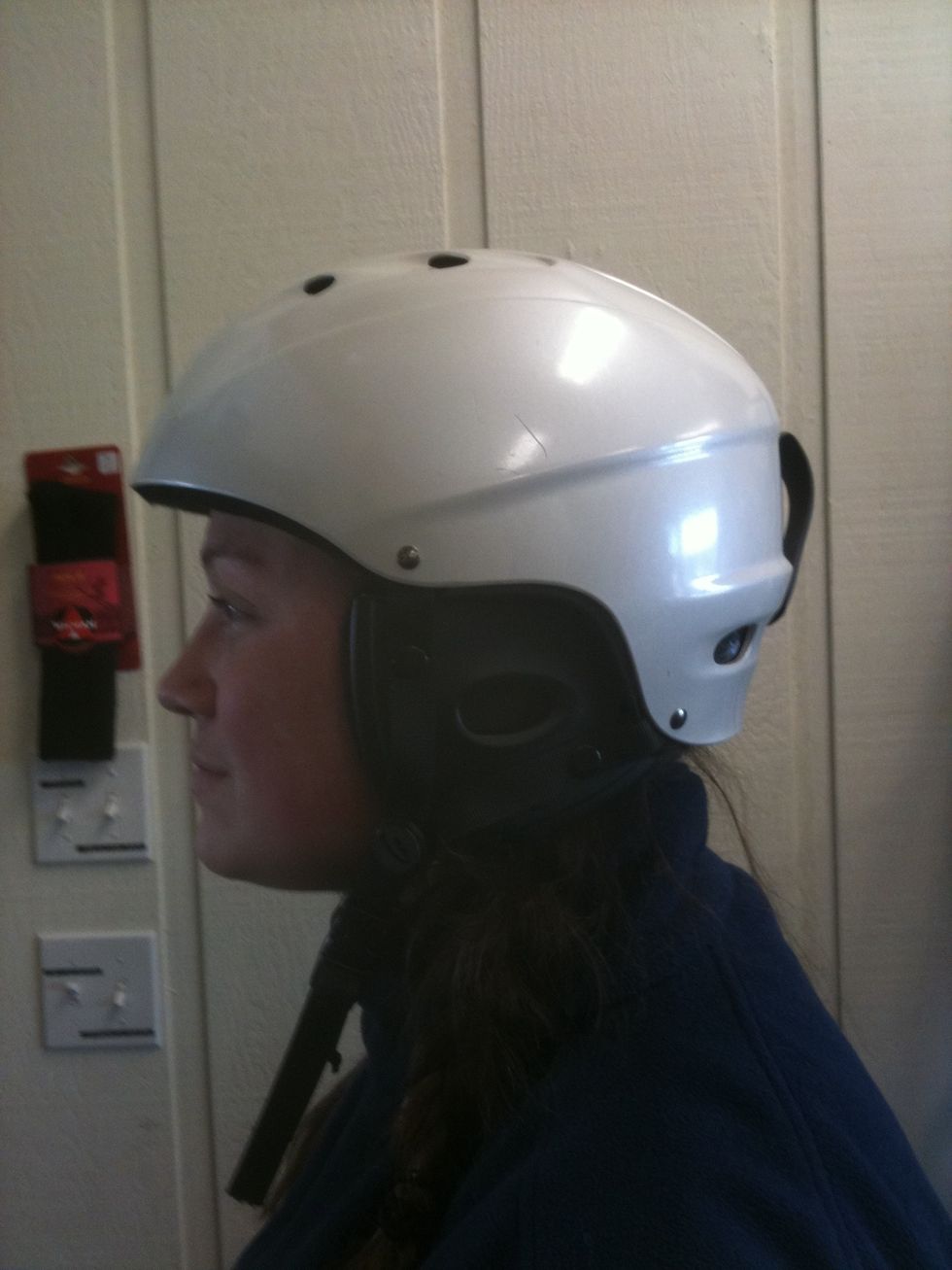 Helmet should fit snug, front should cover your forehead. It is not recommended to wear anything under your helmet.