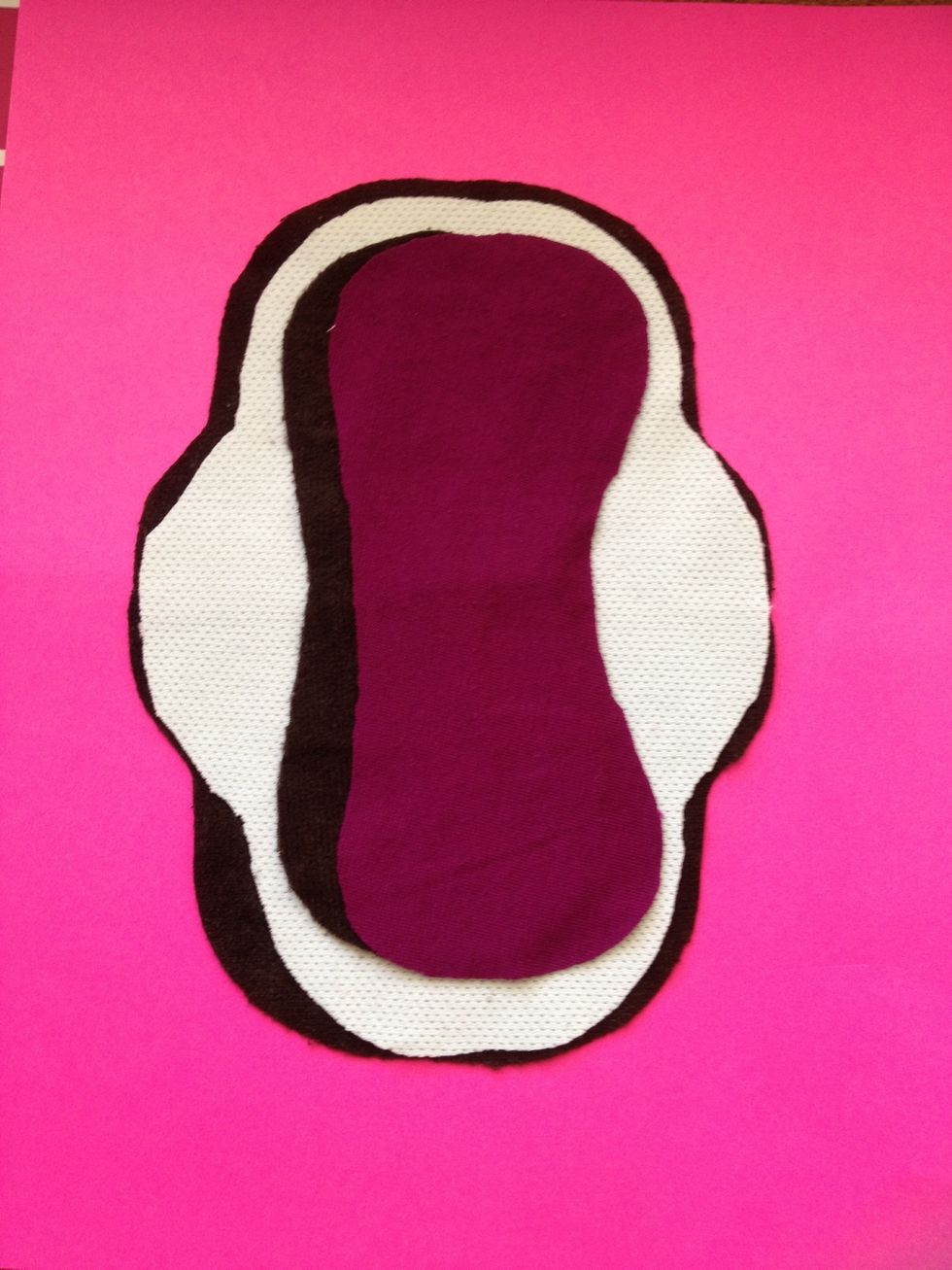 Here are all of the layers put together. Bottom is suede cloth (cut 1/8" wider than pattern for easier sewing), then white "stay dry", then 1 suede cloth inner and one inner layer of upcycled cotton.