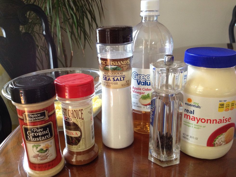 Here are all the ingredients ready to make our deviled eggs!  I have mashed the egg yolk with a fork. Add to the bowl and mix: mayonnaise, vinegar, dry mustard, salt (to taste) and pepper (to taste).