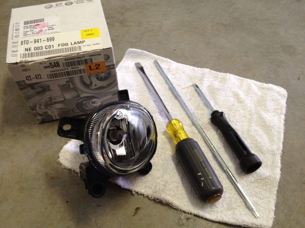 Here are all the supplies: a new fog light unit, the Torx screwdriver piece, and the Phillips/Flathead screwdriver with universal grip. I thought I may need a larger Flathead for prying (didn't use).