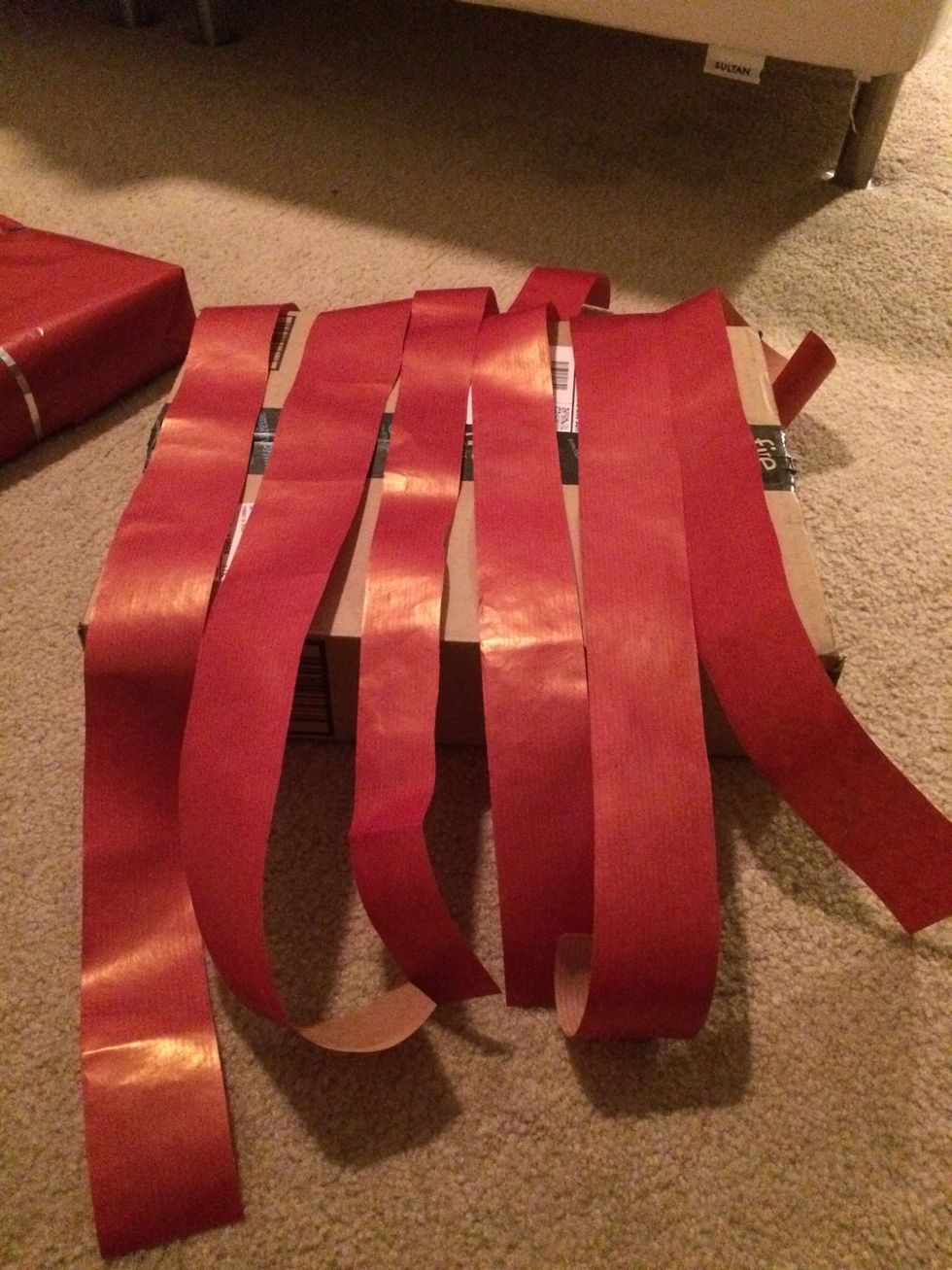 Here are my strips for one direction. Now do the same going in the other direction.  I didn't bother with the back side of the present but feel free to apply same technique to the back and sides.