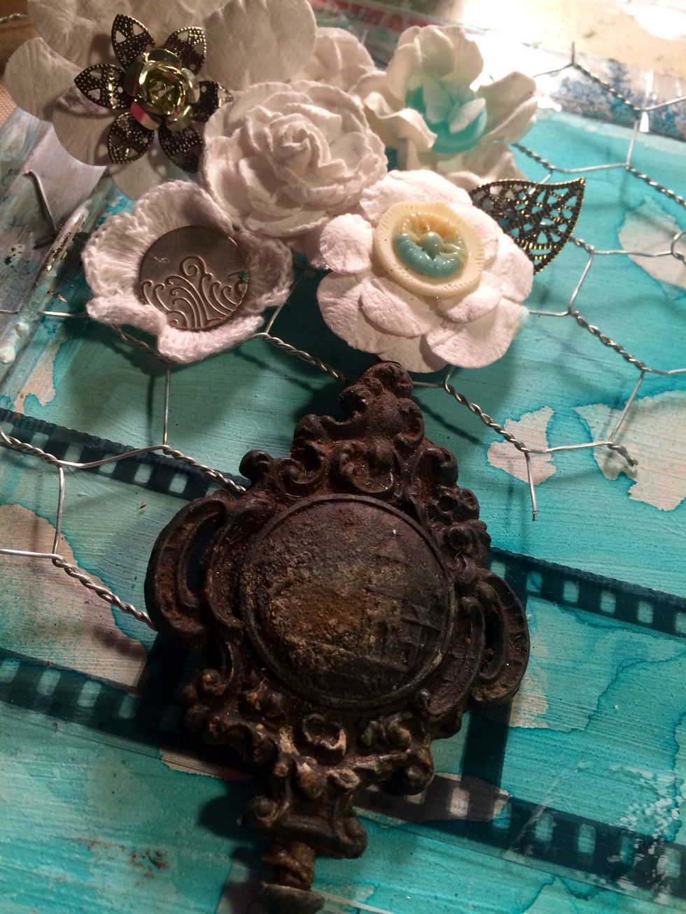 Here are some close up shots of some of the pieces I used. You can glue buttons to the insides of the flowers with hot glue...also use the hot glue to adhere them through the chicken wire...