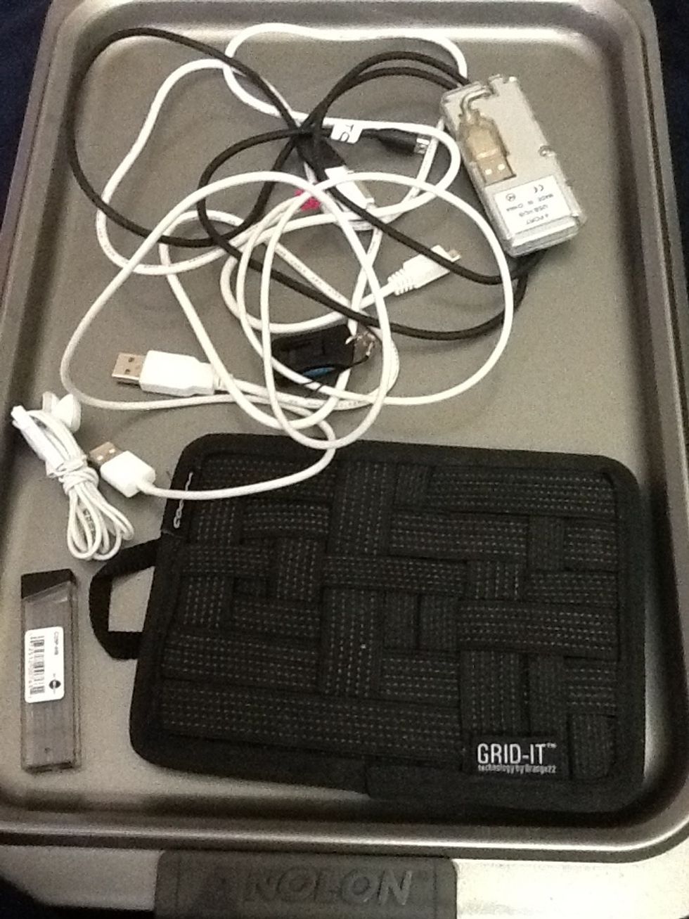 Here are some cords and miscellaneous doodads that I grabbed from my backpack. They're a pain to find when I need them. So I use the Grid-It to keep them organized!