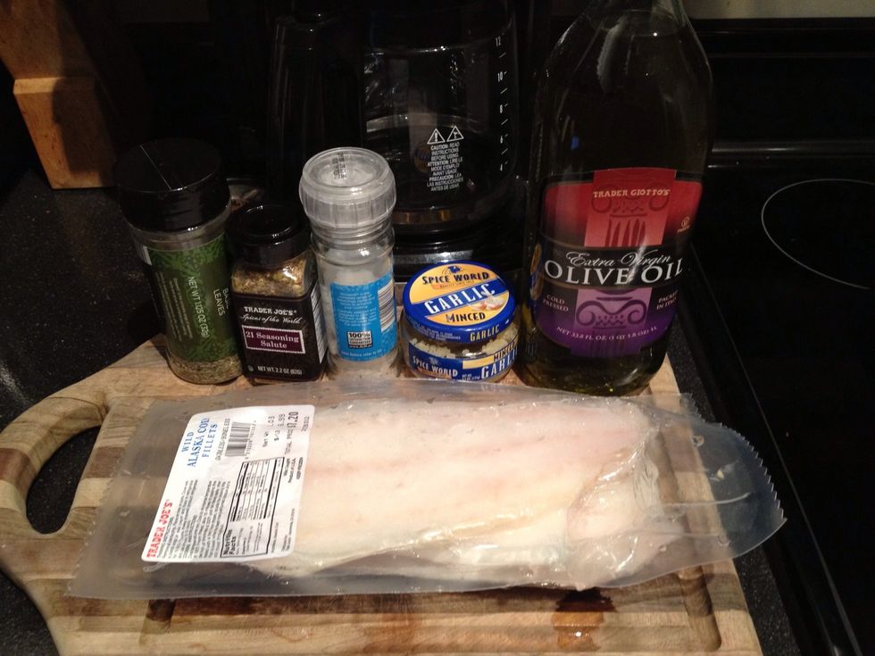 Here are the basic ingredients for the fish: Basil leaves, salt, pepper, garlic, olive oil, and of course your fish fillet of choice.