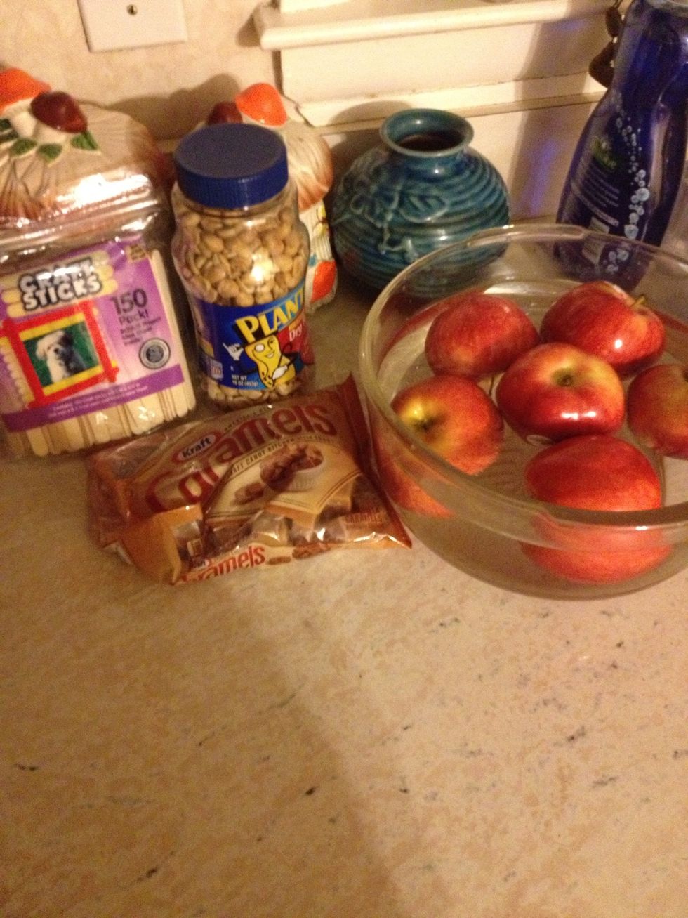 Here are the ingredients I used. I used 5 red apples, dry peanuts, craft sticks, and Kraft's Carmel.