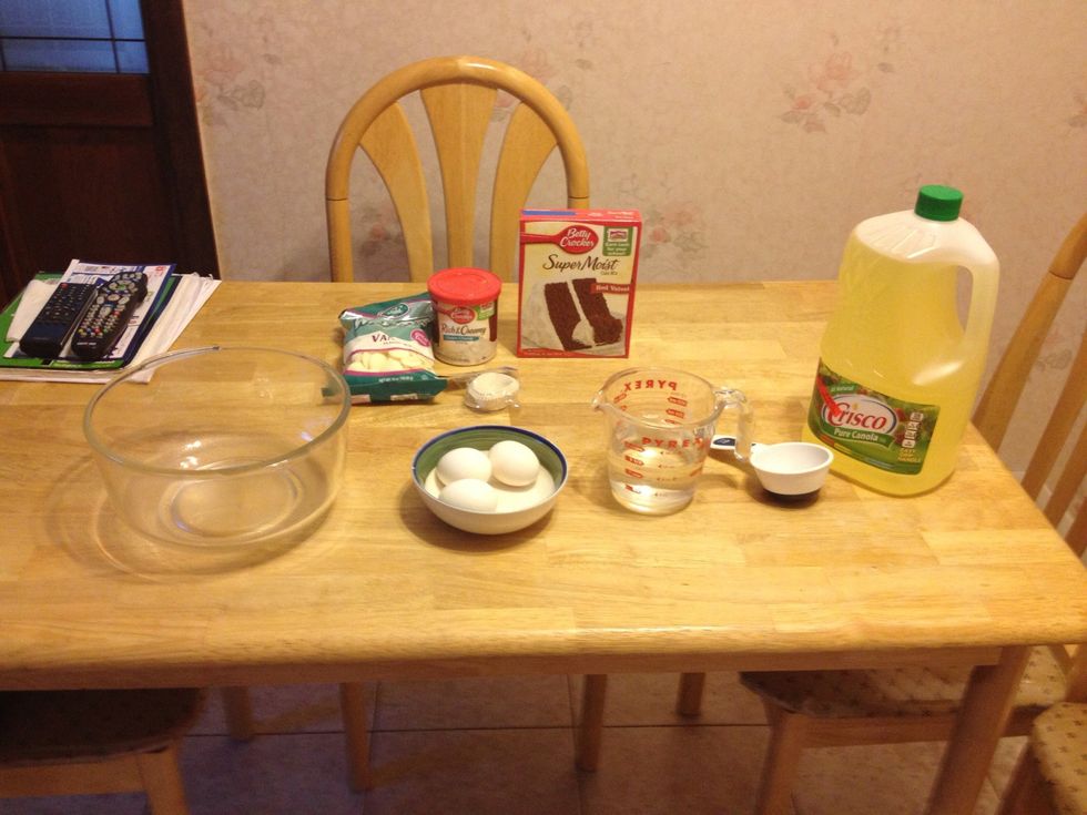 Here are the ingredients: (red velvet box cake mix) 3 eggs, 1/2 cup of vegetable oil, 1 1/4 cups of water. Than you will also need, bowl, plate, frosting ( I used cream cheese frosting), chocolate.