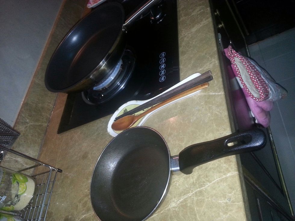 Here are the materials - big fried pan, small fried pan, spoon, and chopsticks