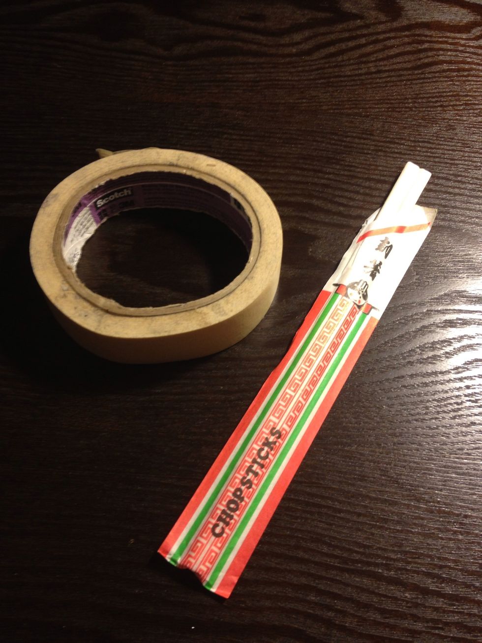 Here are the materials you will need. A roll of masking tape and a pair of wooden chopsticks.