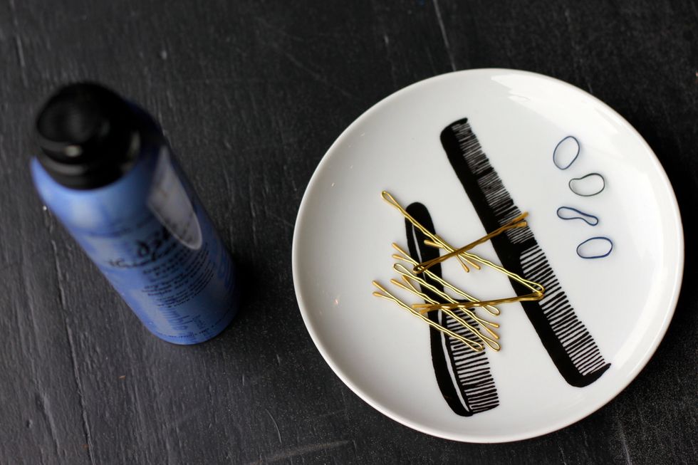 Here are the supplies you'll need. A good texturizing spray, bobbies, and elastic bands. This is a great look for second-day hair