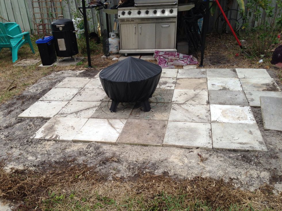 Here are the tiles mid-lay. Some were significantly thicker than others so we would move the sand/soil sub layer so that they would all lay flat.