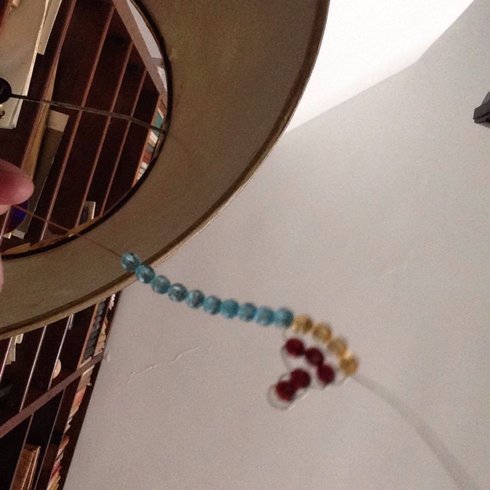 Here come the wings. Thread 10 beads on one of the wires