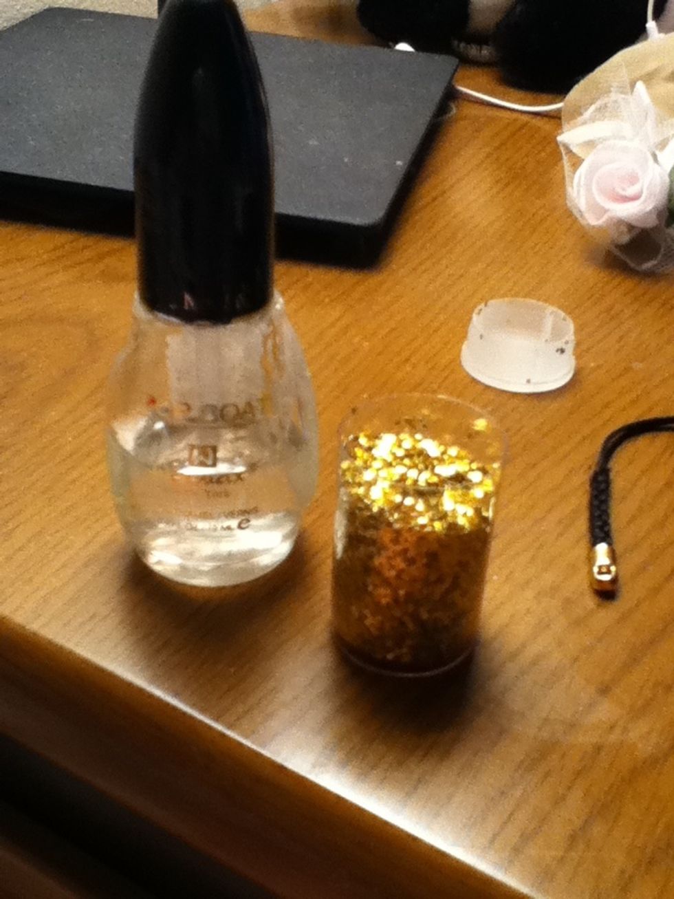 Here comes the coolest part. So basically, you're going to dip the clear polish in the glitter and paint the tips of your nails.