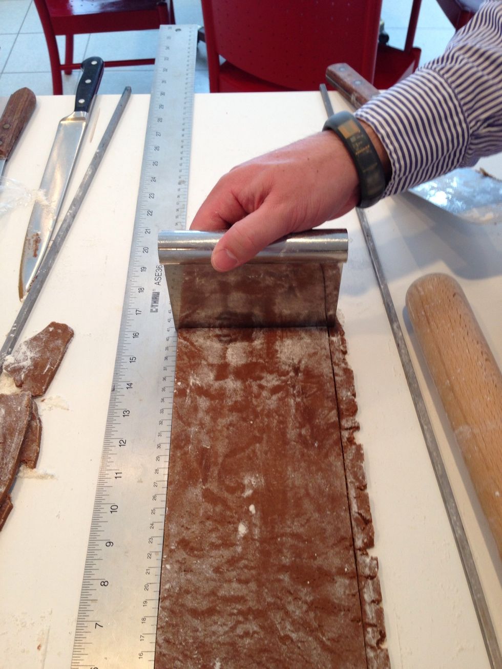 Here, he uses the "bench scraper" as cutting tool. Where, you ask, are the big knives? Patience.