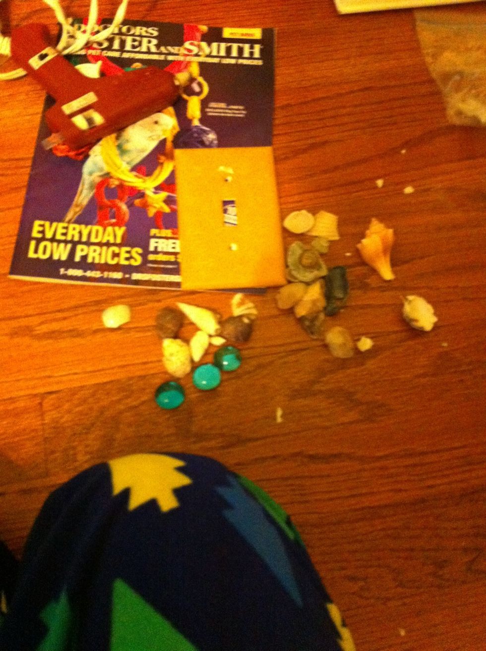 Here I got my seashells and my hot glue gun ready