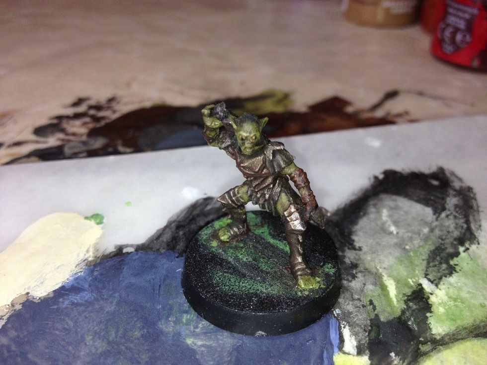 Here I have a fully painted Citadel miniature. For this tutorial, I'll be using a Moria Orc.