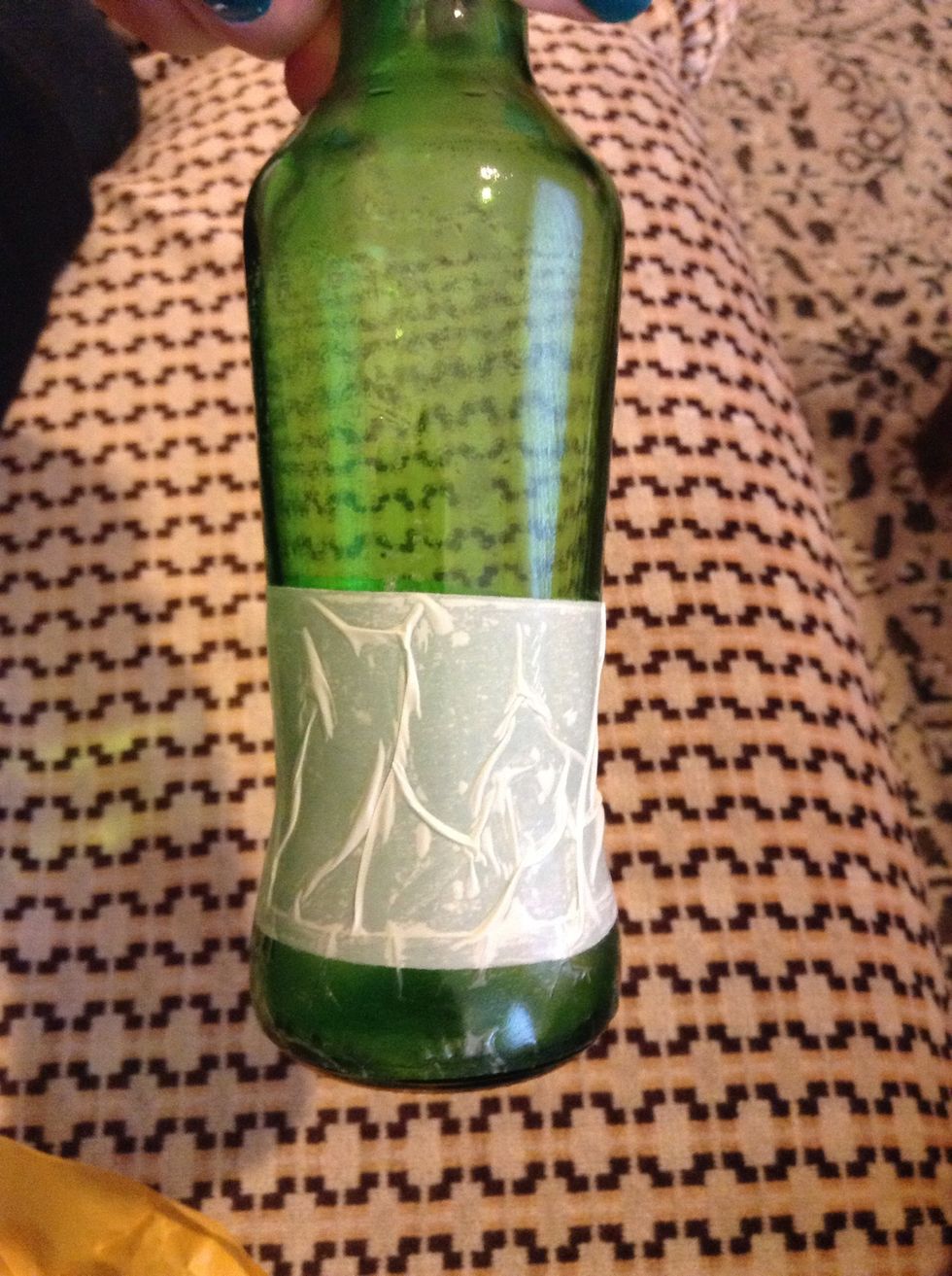 Here I have added doubled sided tape from the bottom of the bottle. I'm using two different sizes of tape, one is white and one is see threw. That doesn't matter.