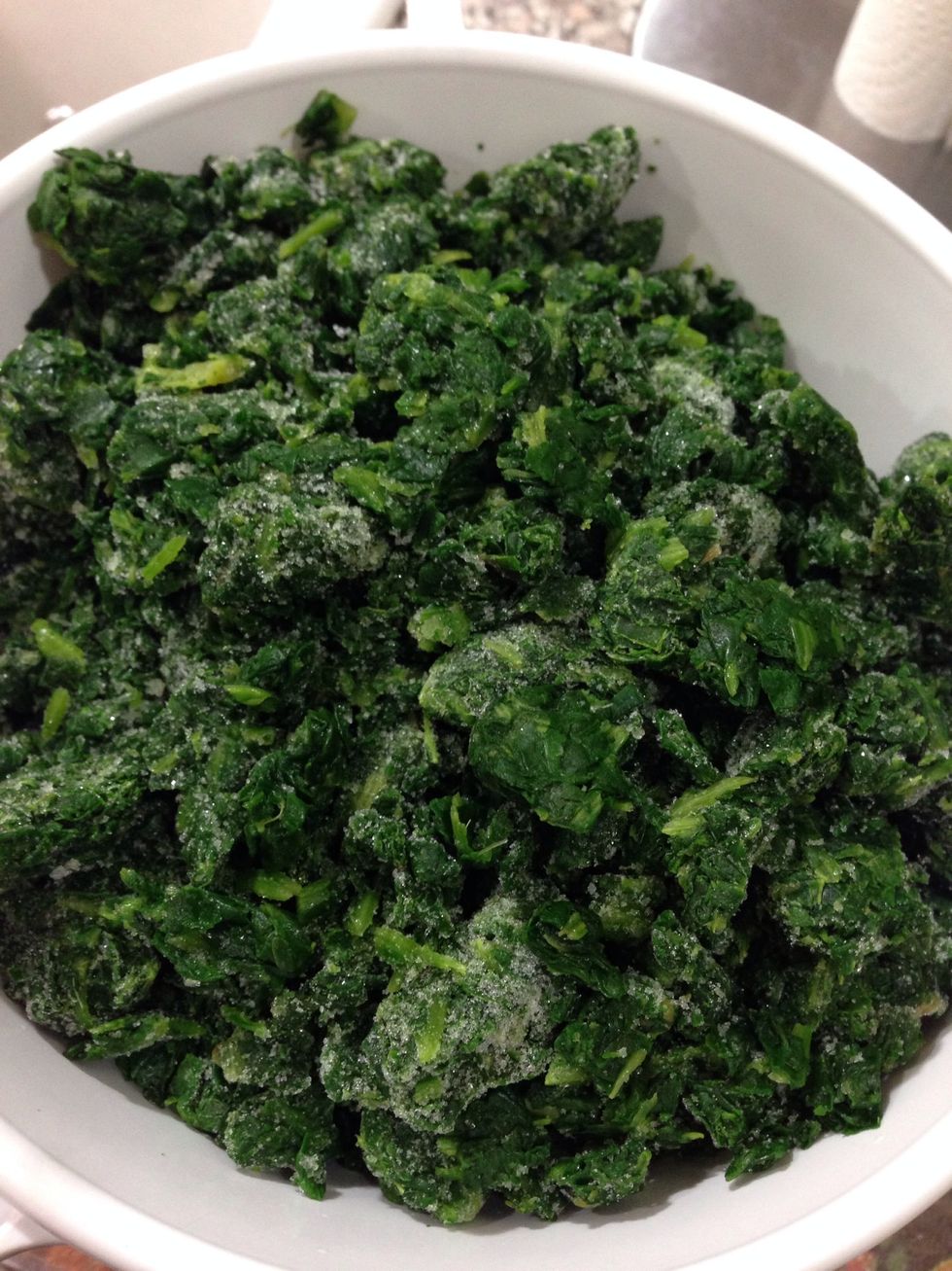 Here I have frozen chopped spinach. I ran it under warm water to thaw it quickly (forgot to thaw it out - oops!). Hopefully you don't forget! Once it's thawed all of the water must be squeezed out!