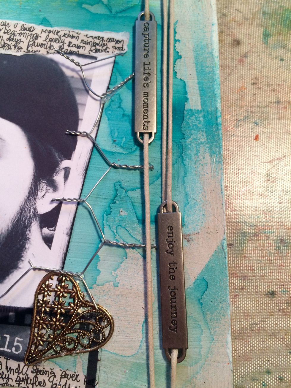 Here I just slid the word bands onto the string and wrapped it around the board...again using hot glue to adhere the loose end to the back and also behind one of the word bands.