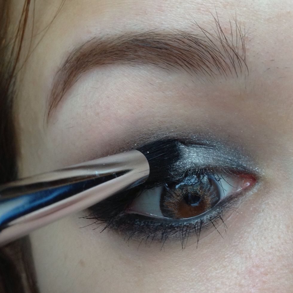 Here I'm adding a light sparkly cream to the inner corners...