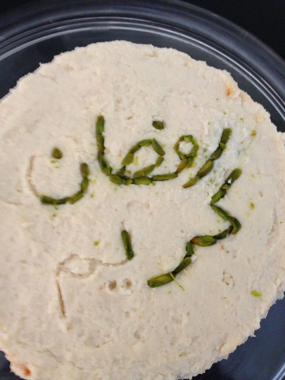 Here I wanted to decorate on the occasion of the coming holy month of Ramadan. First I wrote the words with a toothpick then cut the pistachios into sticks to finish the text. \u0631\u0645\u0636\u0627\u0646 \u0643\u0631\u064a\u0645.