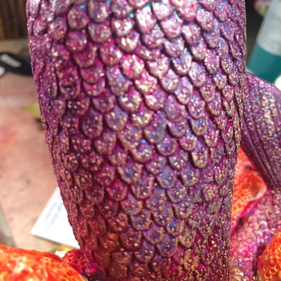 Here is a close up of the scales on her tail. I rubbed it with some Champagne Ice Metallic Lustre. It helped to give some more dimension to the scales, and its shiney, I love shiney.