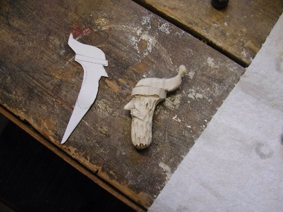 Here is a comparison with the pattern, note I make the beard different lengths, use your imagination.  No two Santas are ever alike!