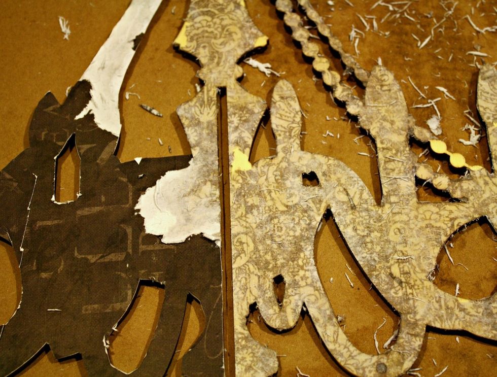 Here is a "during" shot to see the top layer of paper rubbing off. Do not rub too hard or get it too wet. You just want all that "white" color pulp gone, leaving a beautiful pattern behind.